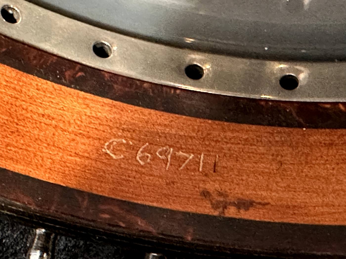 Inscription C 69711 verification point, on the inside of the maple rim